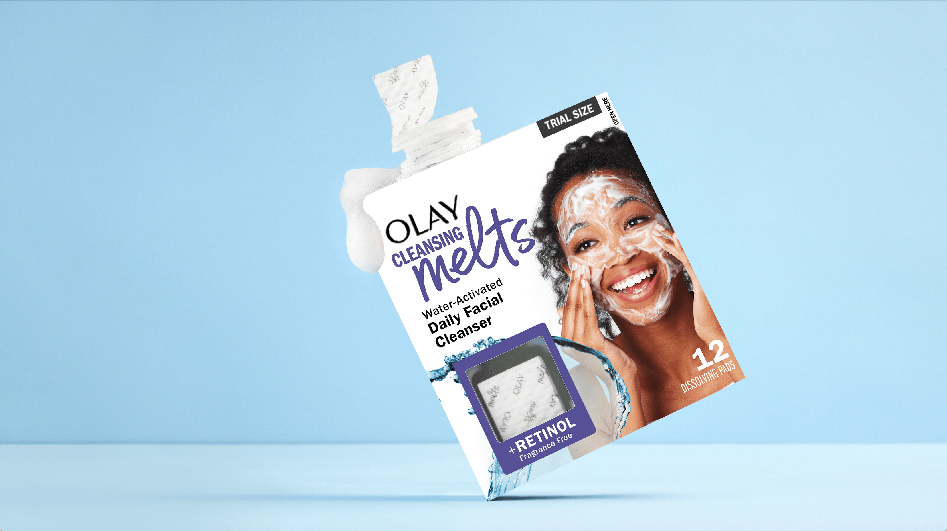 Olay Cleansing Melts packaging on a light blue background